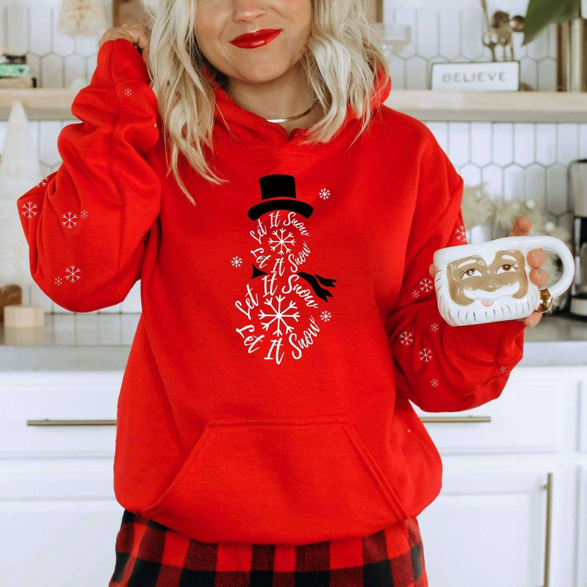 Winks Design Studio LLC Let It Snow front pocket hoodie, cozy black hoodie with festive snowflake design and front pouch pocket.