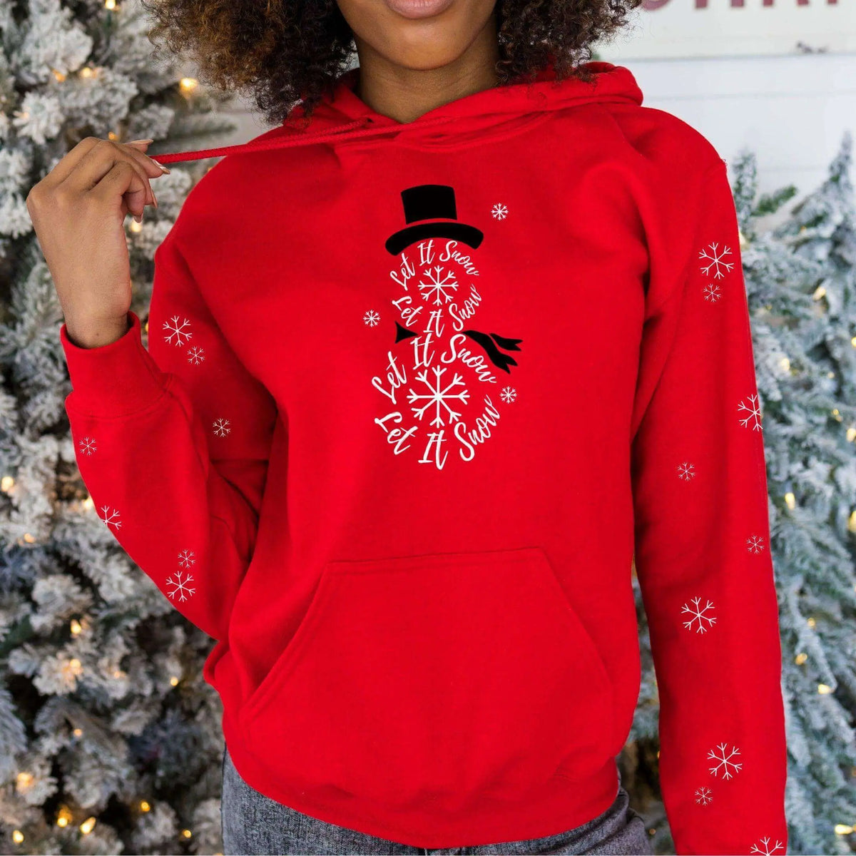 Winks Design Studio LLC Let It Snow front pocket hoodie, cozy fabric, casual fit, with snow-themed print on the front.