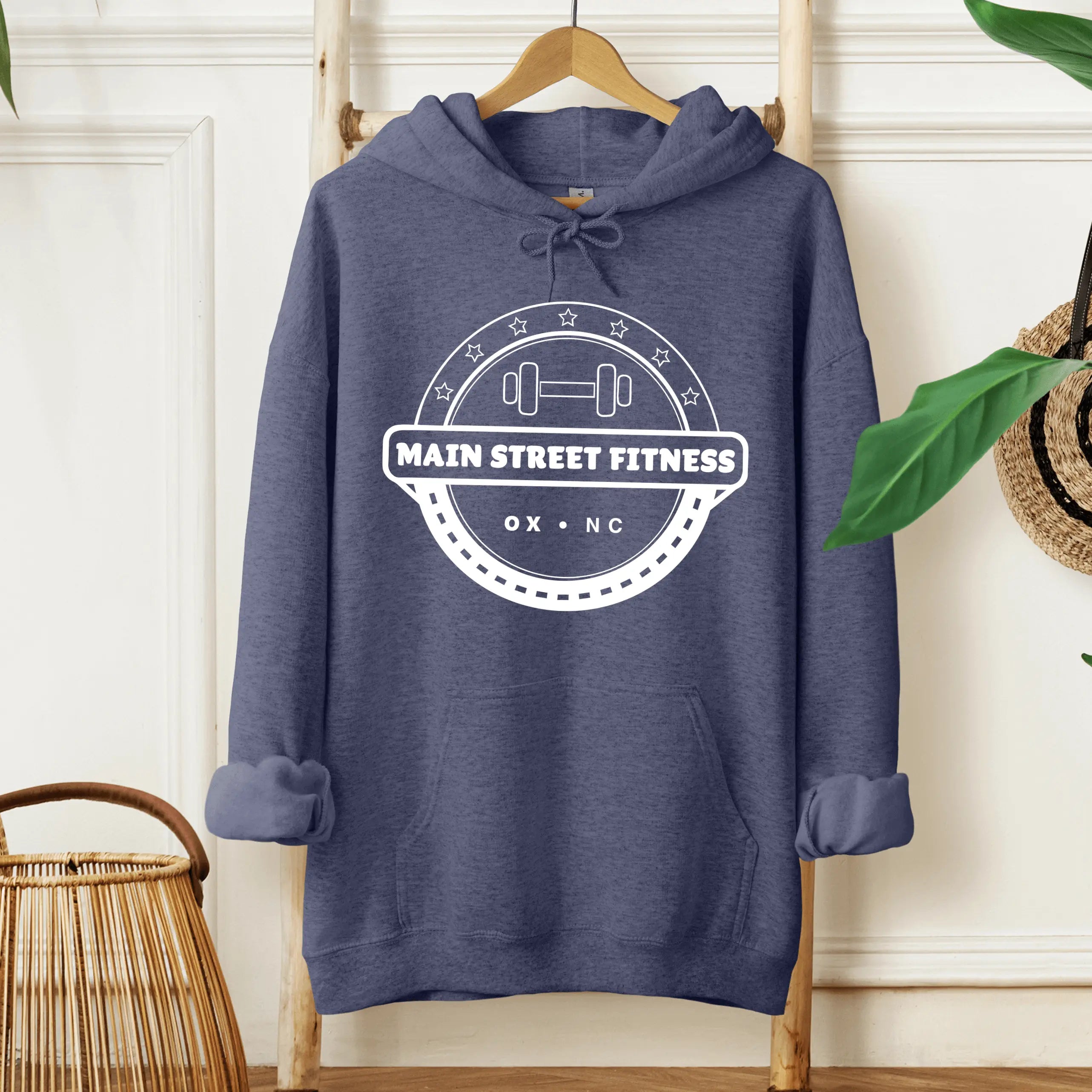 Winks Design Studio, LLC Main Street Fitness front pouch hoodie in black, showing the hoodie with front pouch pocket and hood detail.