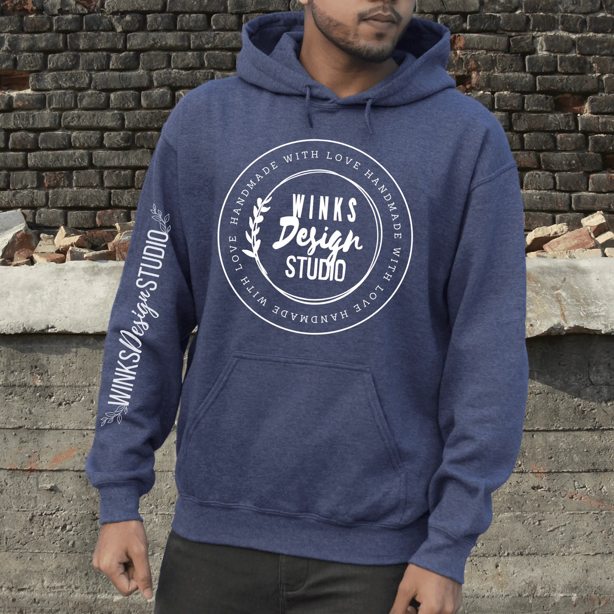 Sand-colored hoodie with a front pouch featuring the Winks Design Studio logo, casual style and comfortable fit.