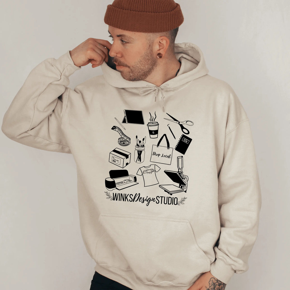 Sand-colored Winks Design Studio WDS Pattern Front Pouch Hoodie with a cozy front pocket and stylish design details.