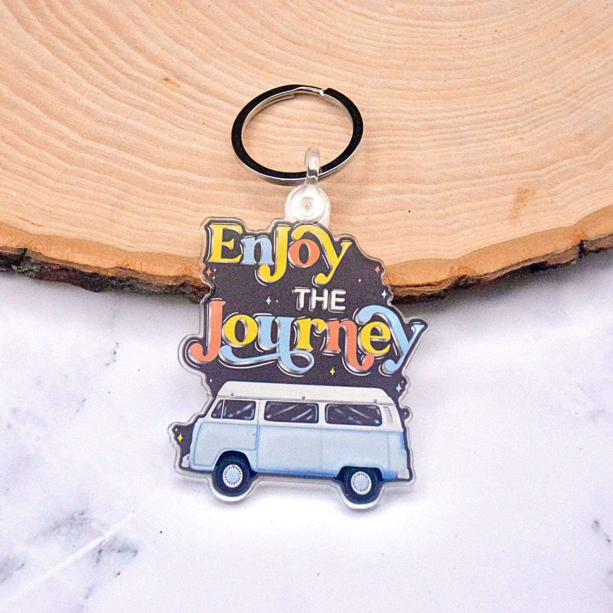 Retro 70s Van keychain by Winks Design Studio, LLC featuring a colorful vintage van design on a metal keychain.