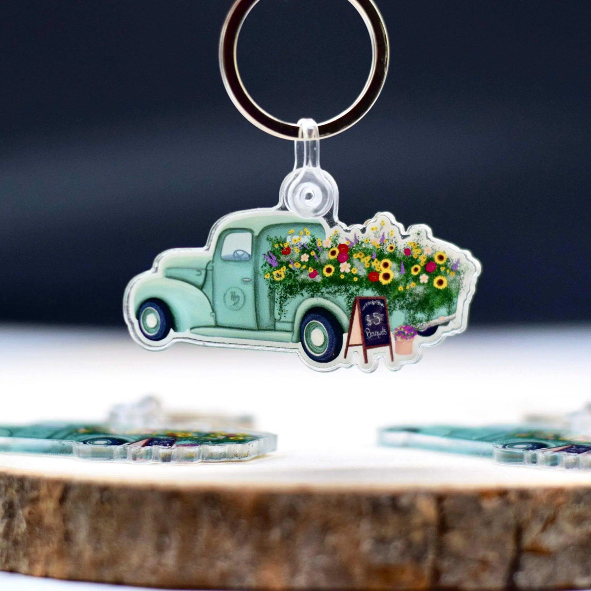 Antique flower truck keychain by Winks Design Studio, LLC featuring a detailed vintage floral truck charm.