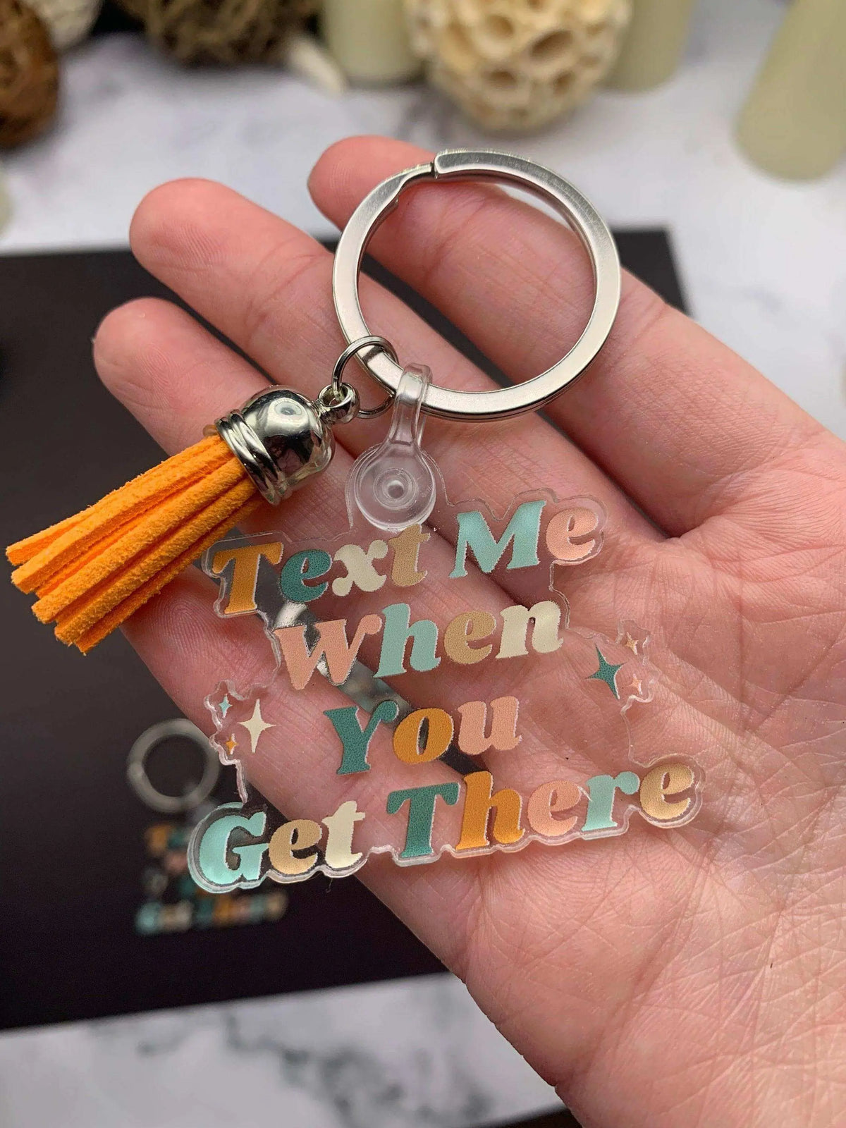 Drive Safe keychain by Winks Design Studio LLC with engraved "Text Me When You Get There" message on a metal keychain.