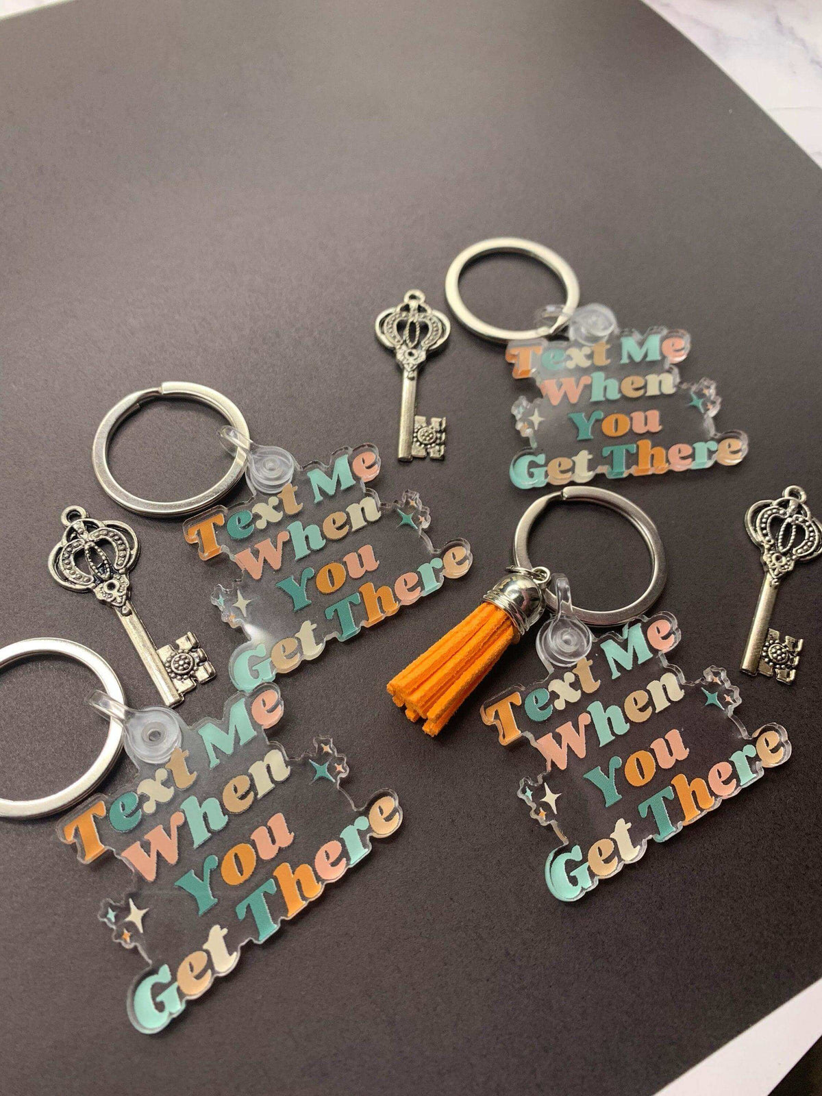 Drive Safe keychain by Winks Design Studio LLC featuring the phrase "Text Me When You Get There" on a stylish keychain.