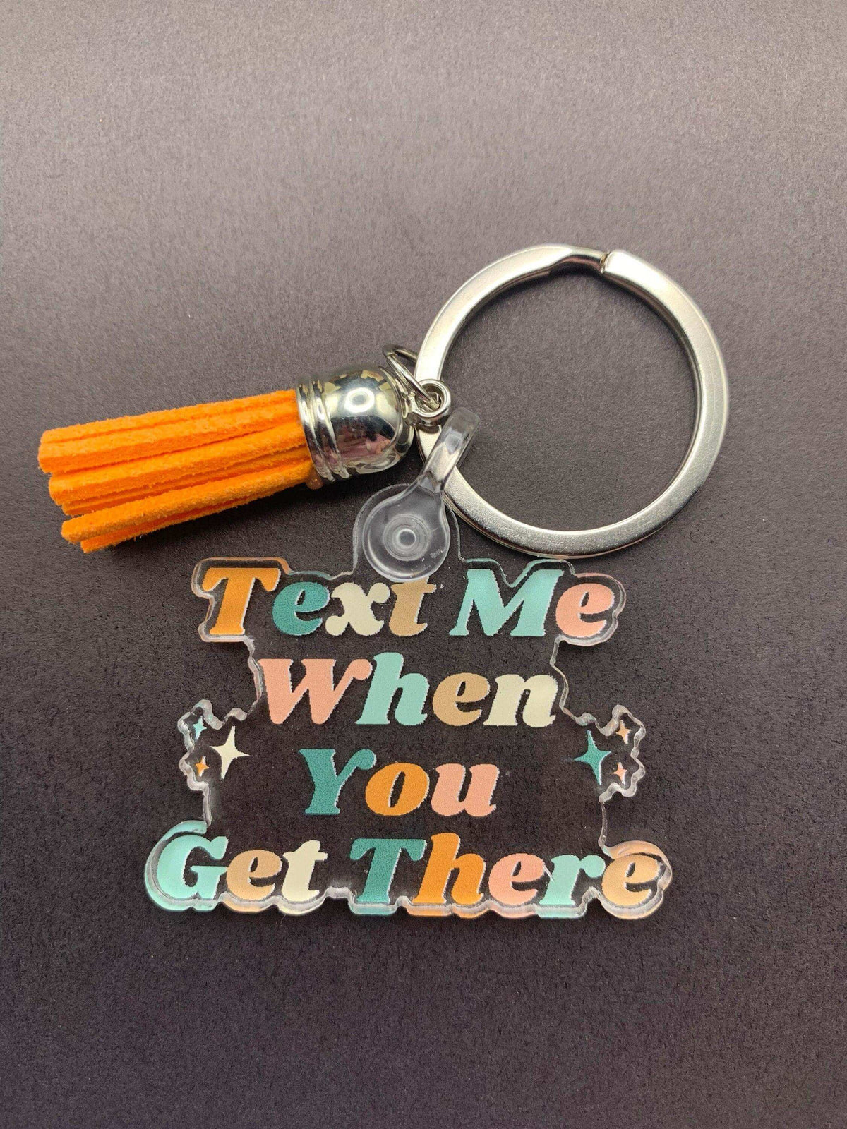 Winks Design Studio LLC Drive Safe keychain with engraved text "Text Me When You Get There" on silver metal keychain.