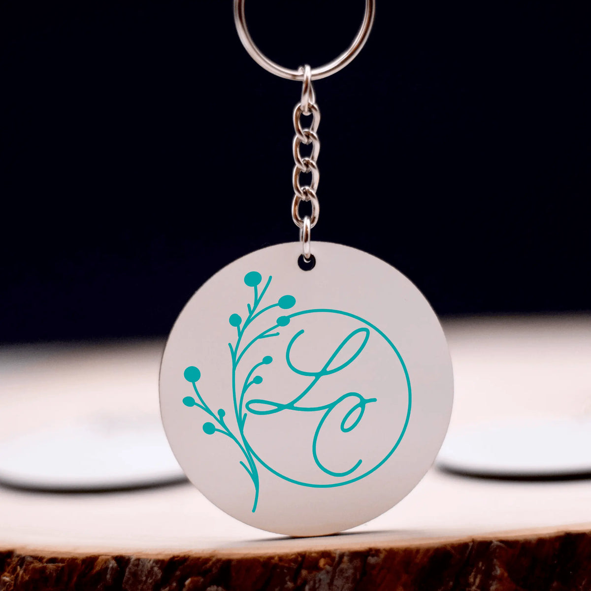 Winks Design Studio LLC Lydia Crouse logo keychain with engraved design, durable metal keychain accessory.