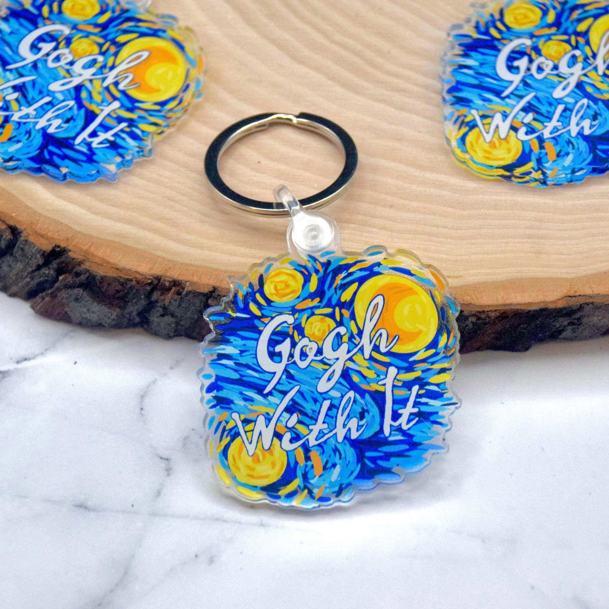 Starry Night acrylic keychain featuring a vibrant night sky design from Winks Design Studio, LLC.