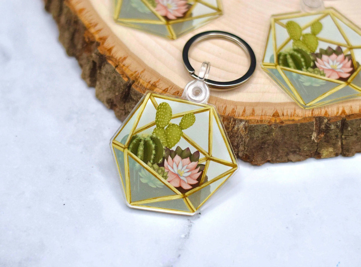 Acrylic succulent terrarium keychain featuring a realistic mini plant design, attached to a metal keyring.