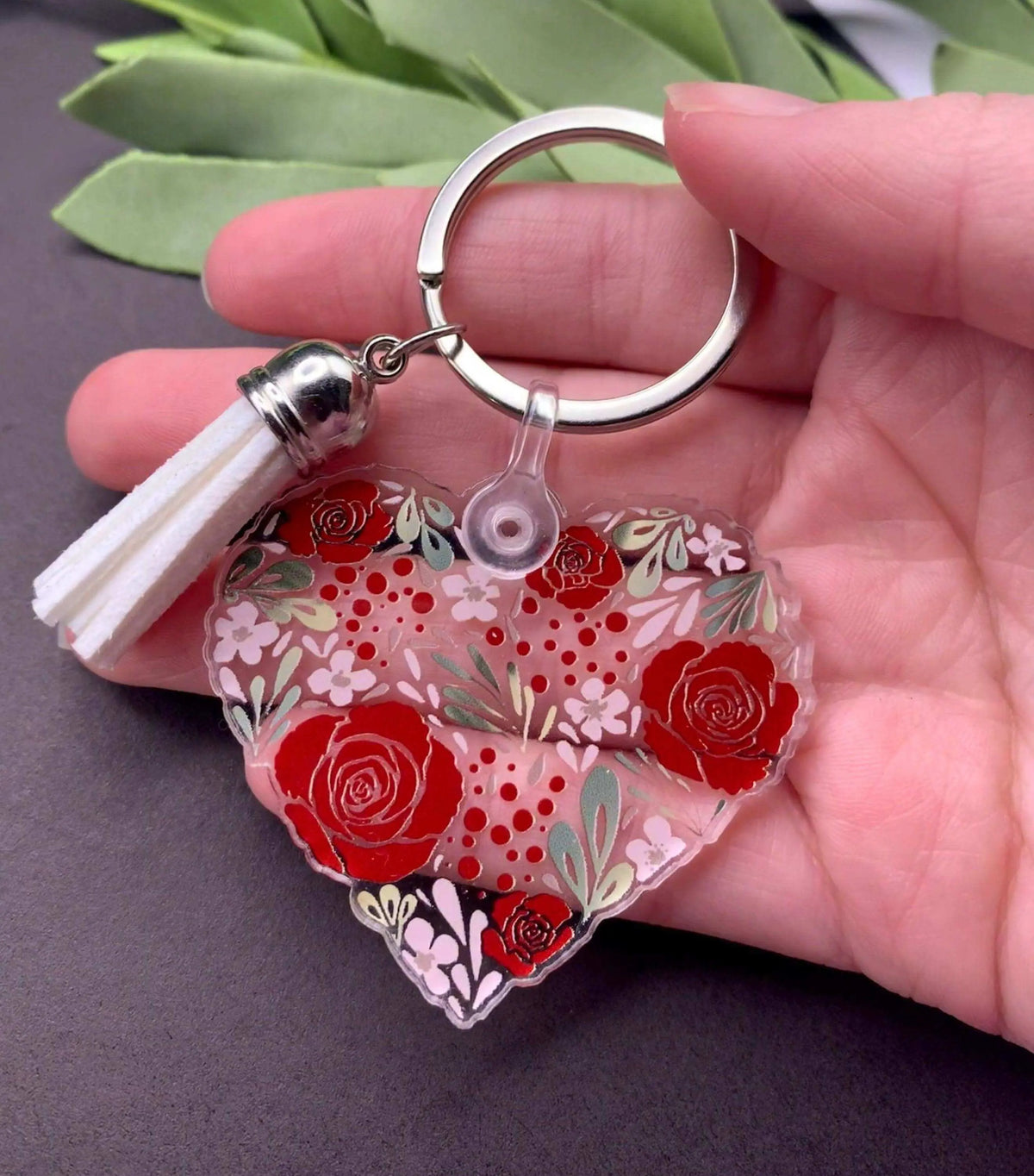 Vintage flower heart keychain by Winks Design Studio, LLC featuring a floral design on a metal keyring.