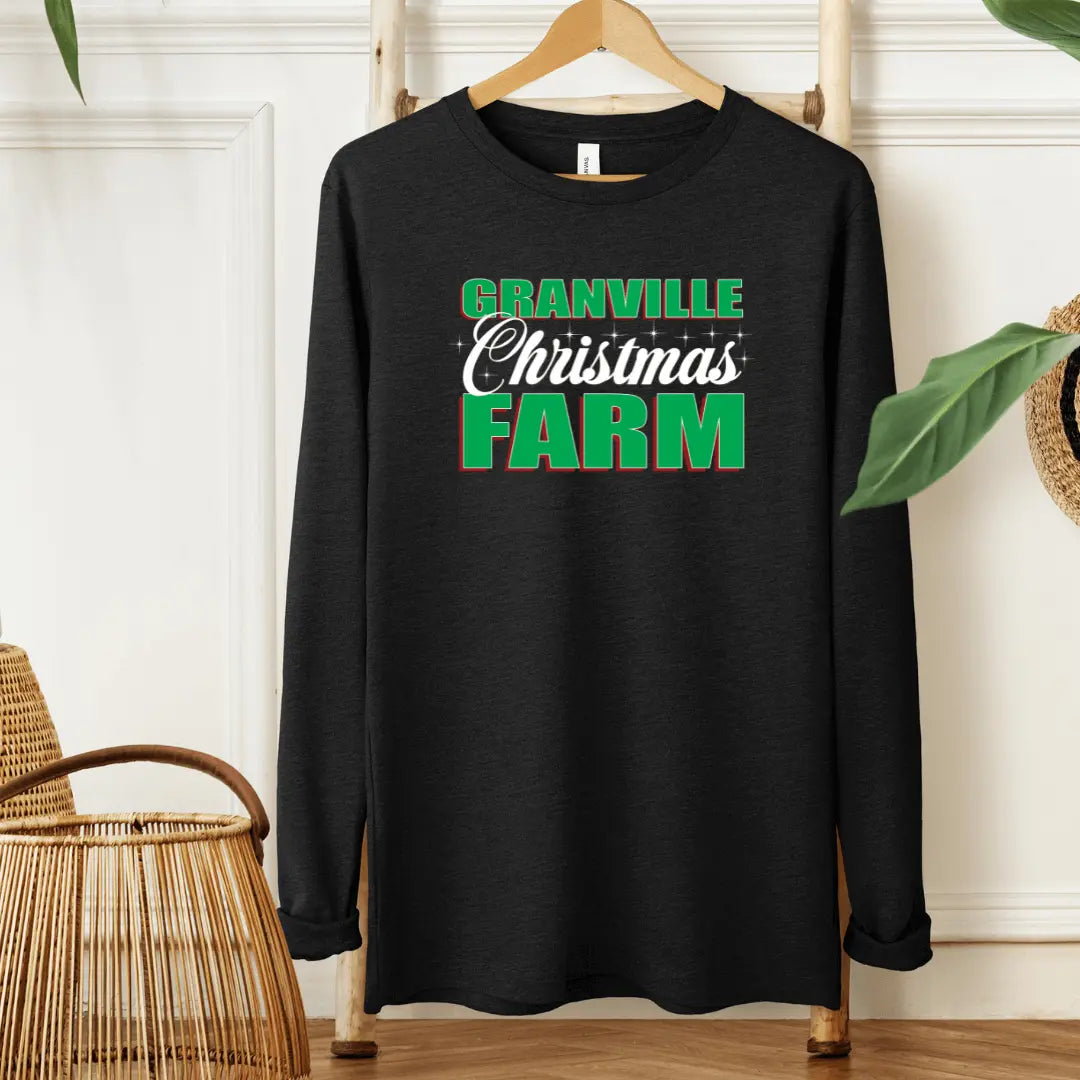 Black Granville Christmas Farm long sleeve shirt by Winks Design Studio, LLC, featuring festive farm-themed graphics on the front.