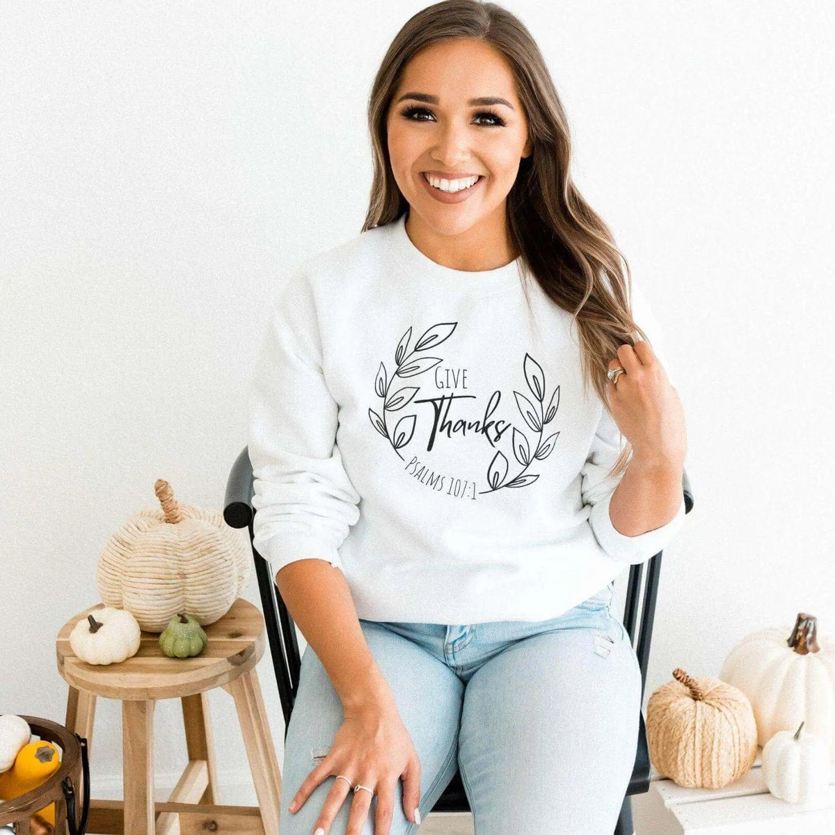 Long sleeve shirt featuring "Give Thanks Psalm 107:1" by Winks Design Studio, LLC, with a natural, comfortable fit and printed message.