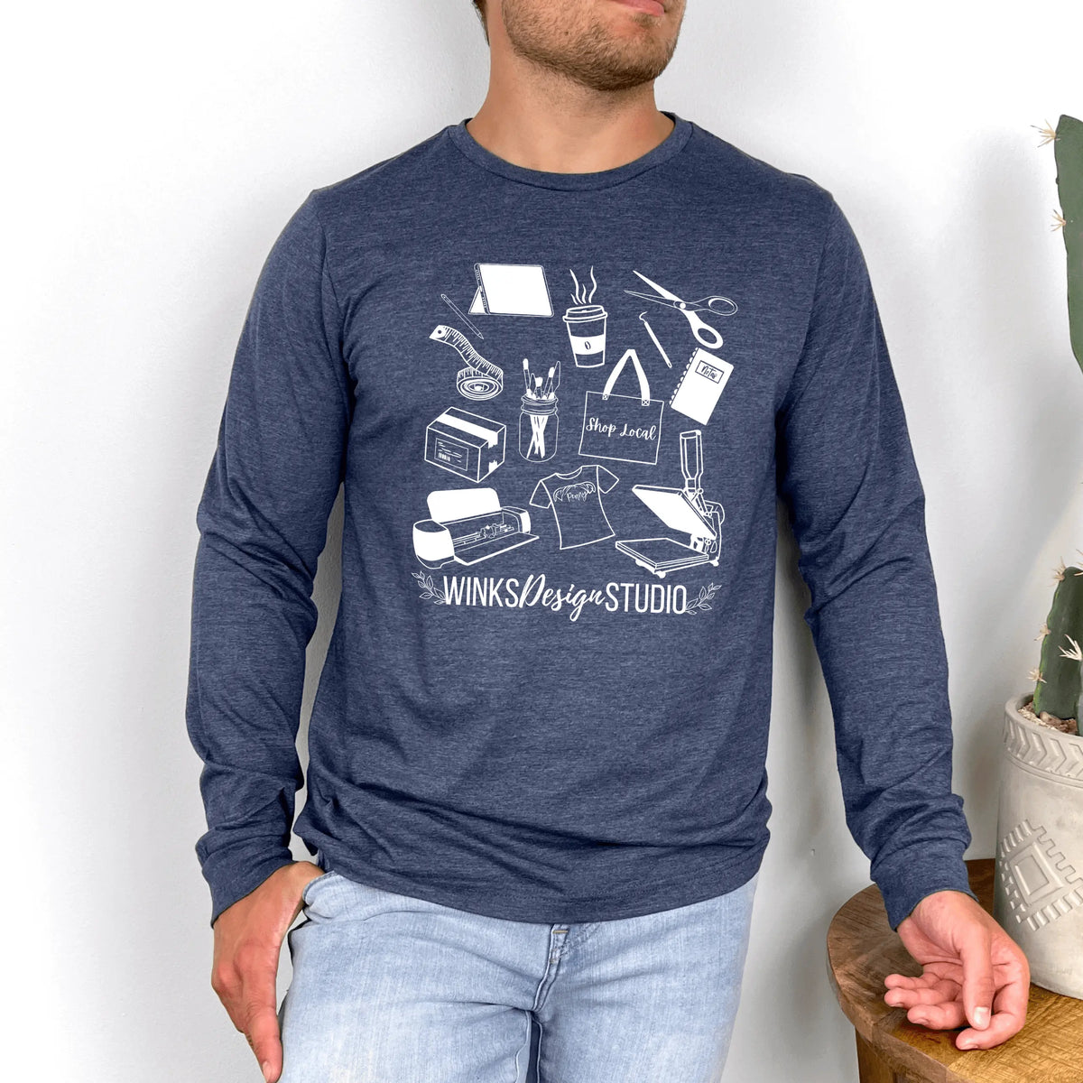 Navy Winks Design Studio LLC long sleeve shirt with a patterned design, shown in a close-up view.