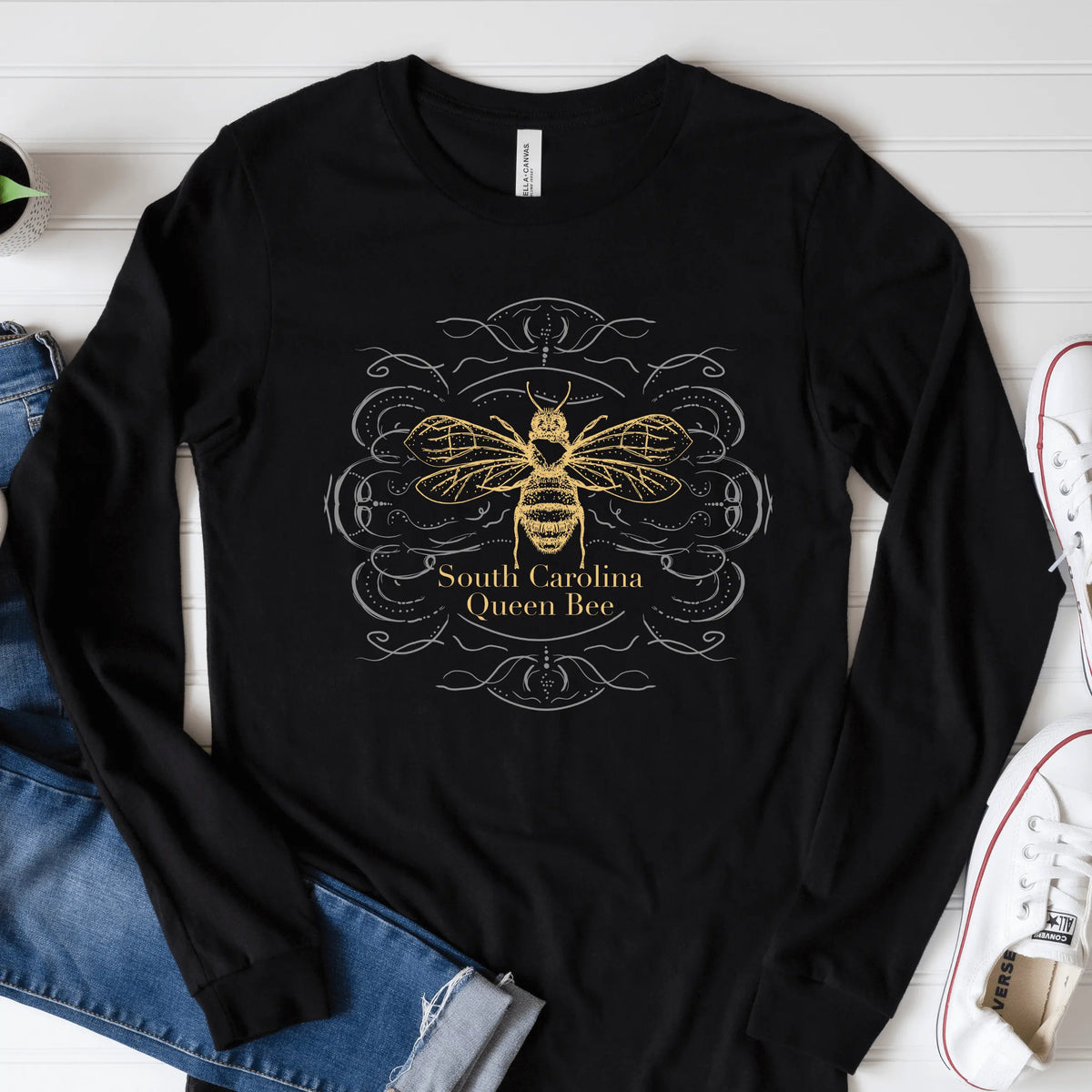 Long sleeve shirt featuring a South Carolina Queen Bee design by Winks Design Studio, LLC, with detailed bee and floral artwork.