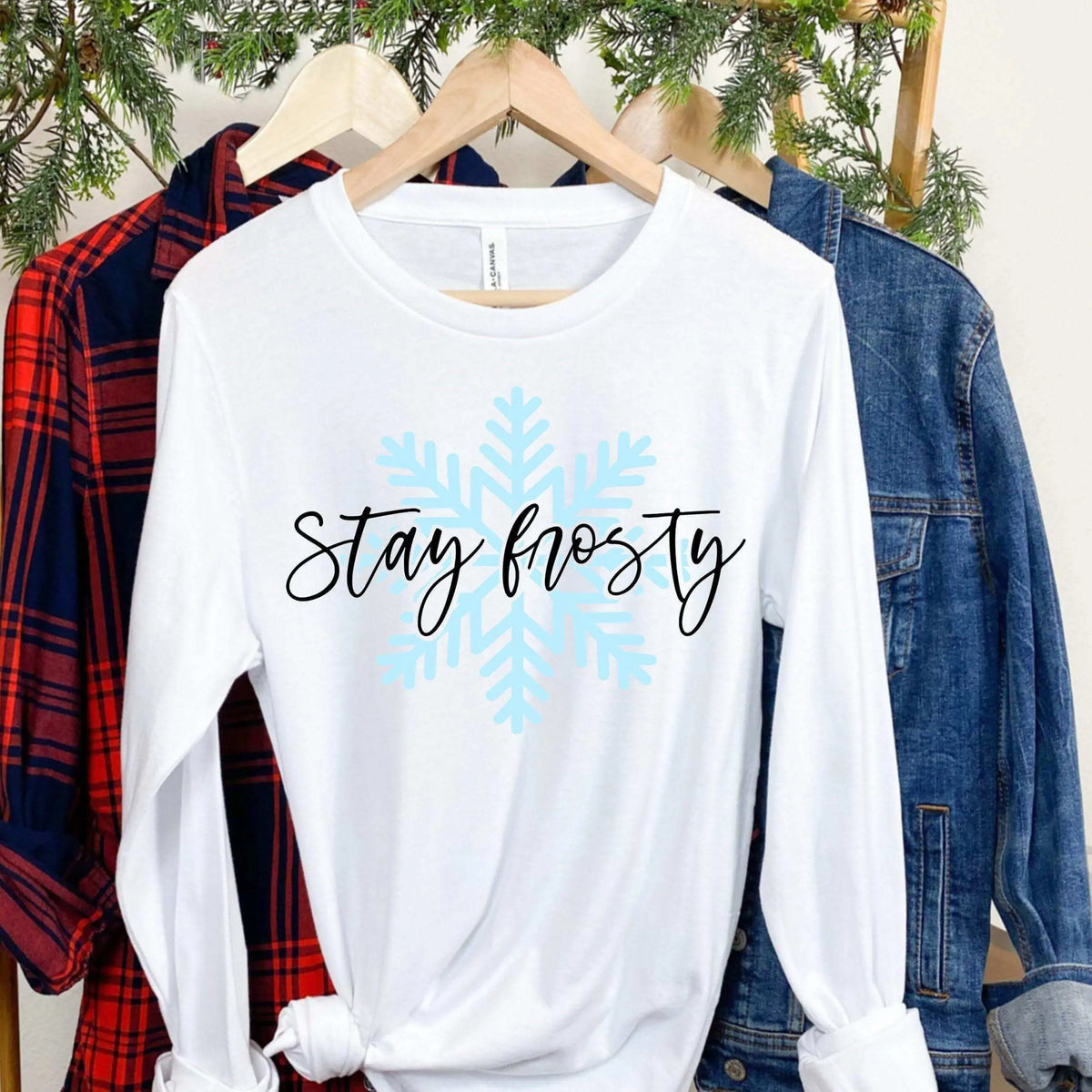 Winks Design Studio long sleeve shirt featuring a snowflake design with "Stay Frosty" text on a small size.