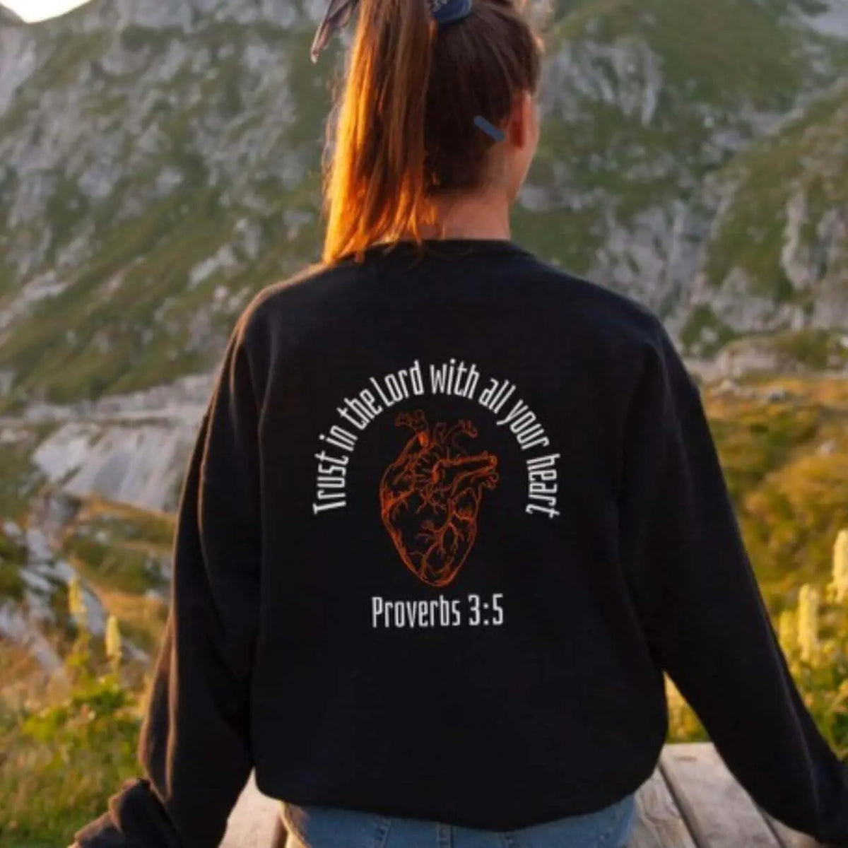 Winks Design Studio LLC long sleeve shirt with "Trust In The Lord" printed on the front, made of soft fabric for comfortable wear.