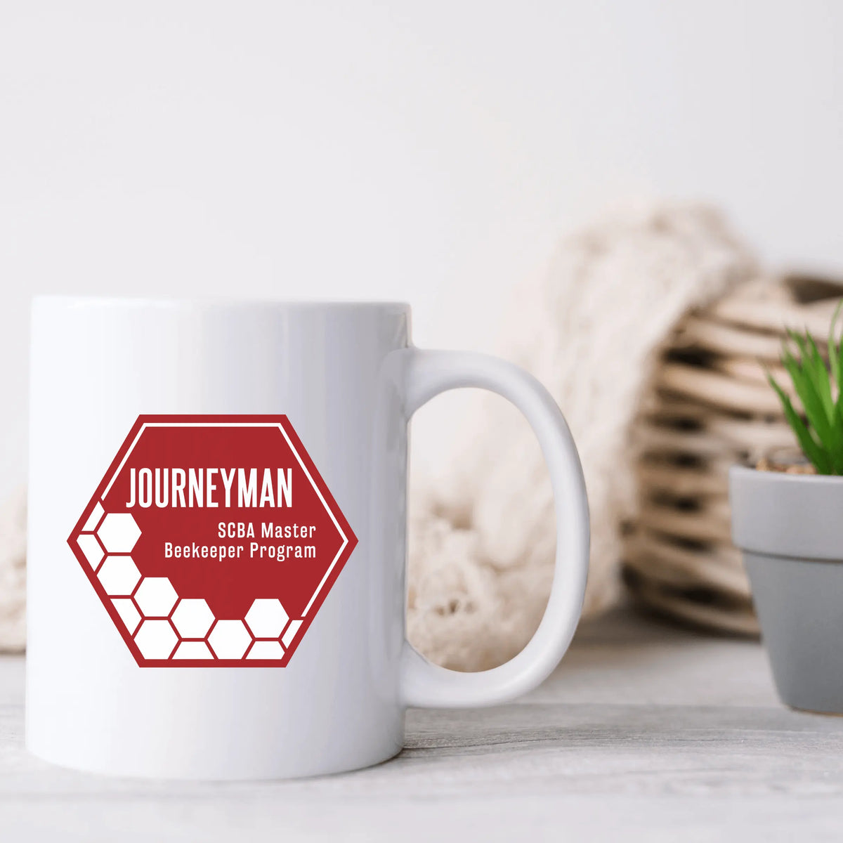 Ceramic mug featuring the SCBA Master Beekeeping Program logo, designed by Winks Design Studio LLC, perfect for beekeeping enthusiasts.