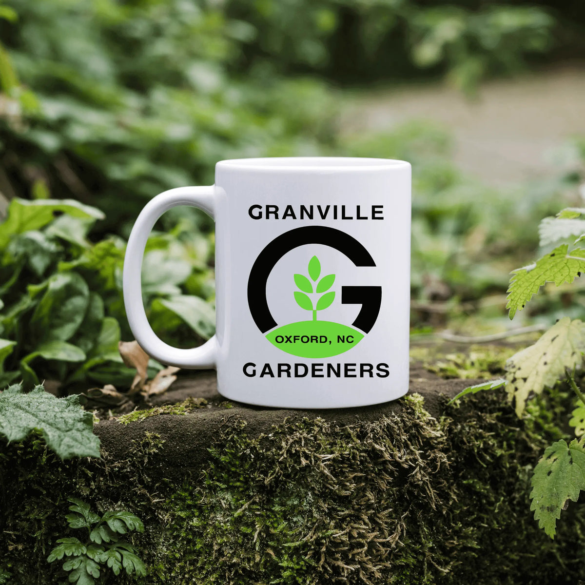 Granville Gardeners ceramic mug by Winks Design Studio, LLC, featuring a detailed garden-themed design and a comfortable handle.