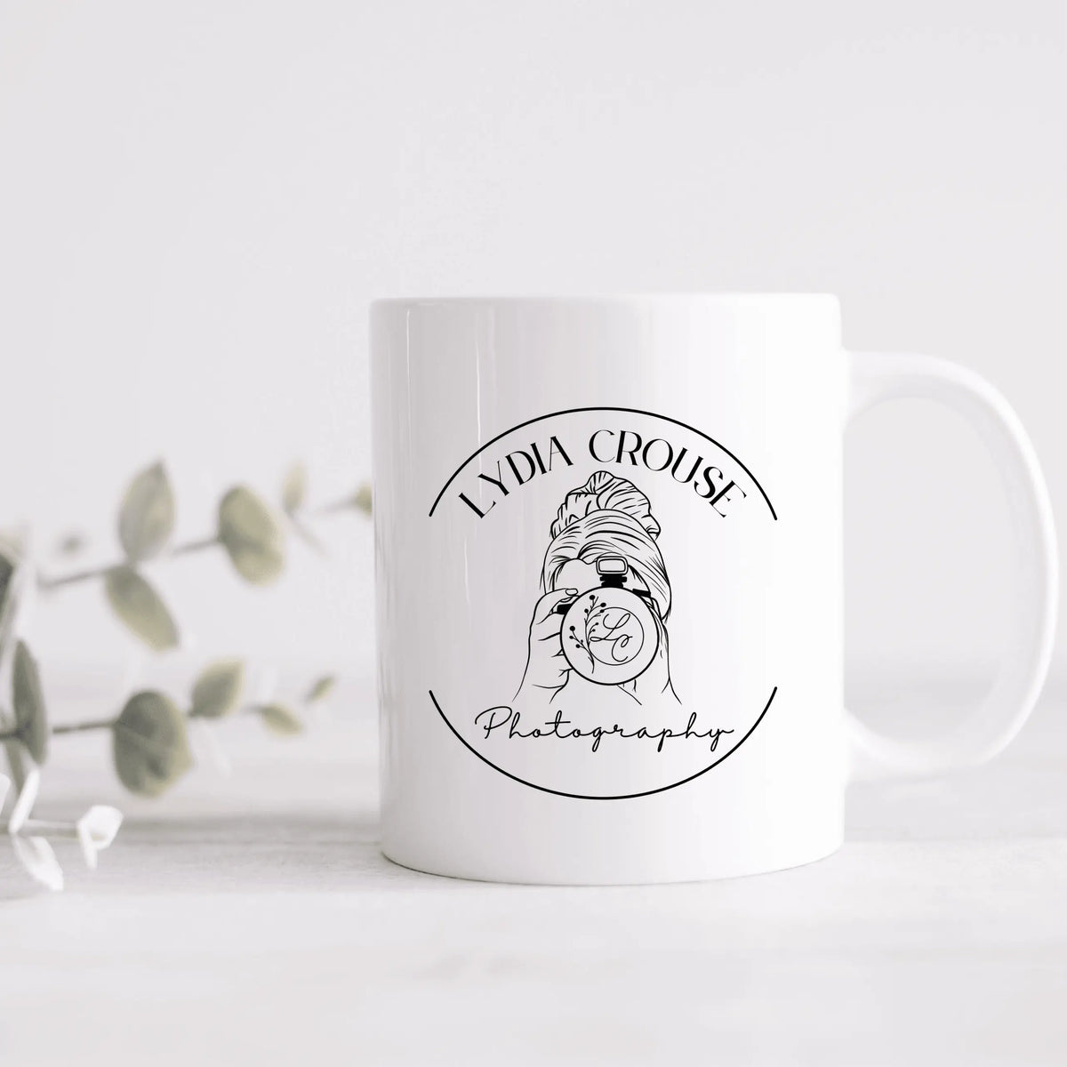 Winks Design Studio Lydia Crouse ceramic mug featuring colorful artwork, white ceramic surface, and a sturdy handle.