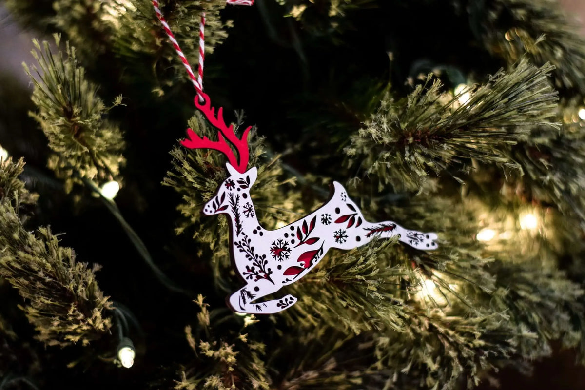 Festive Reindeer Christmas ornament by Winks Design Studio LLC featuring a cheerful reindeer for holiday décor.