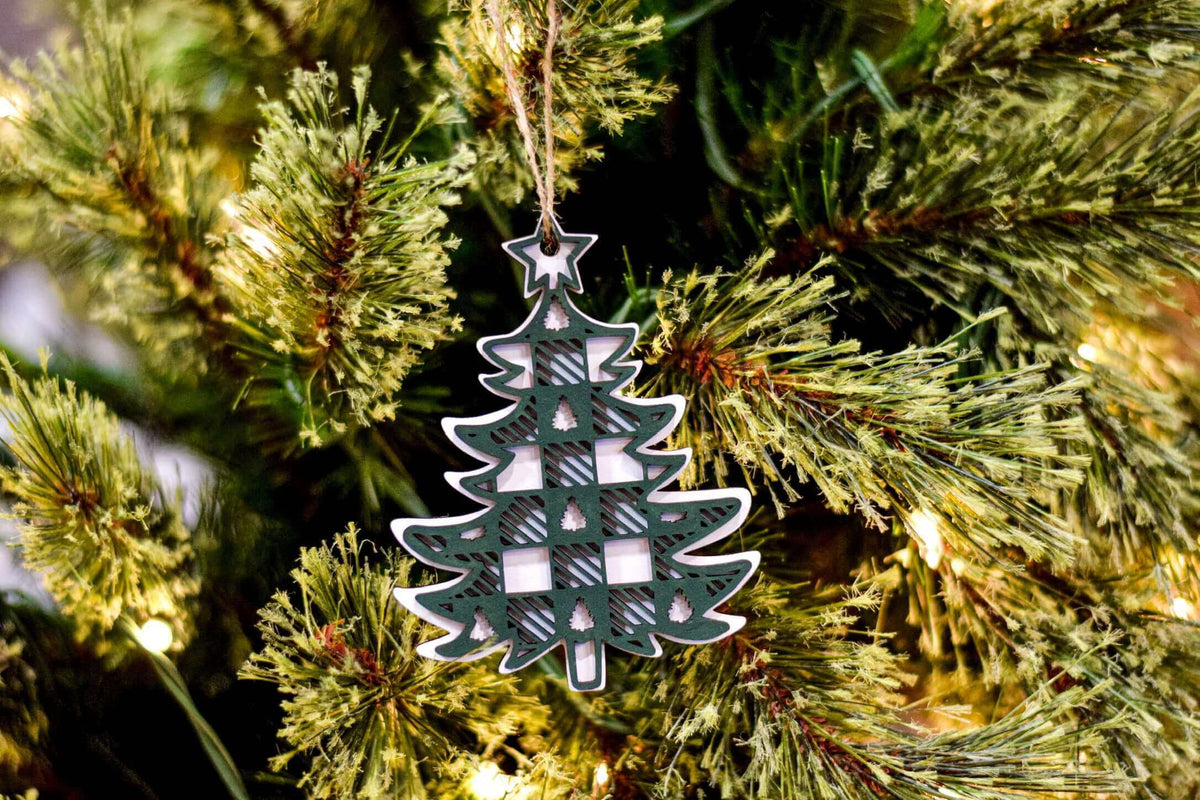 Plaid Christmas Tree Ornament by Winks Design Studio LLC featuring a festive plaid pattern and decorative design for holiday decor.