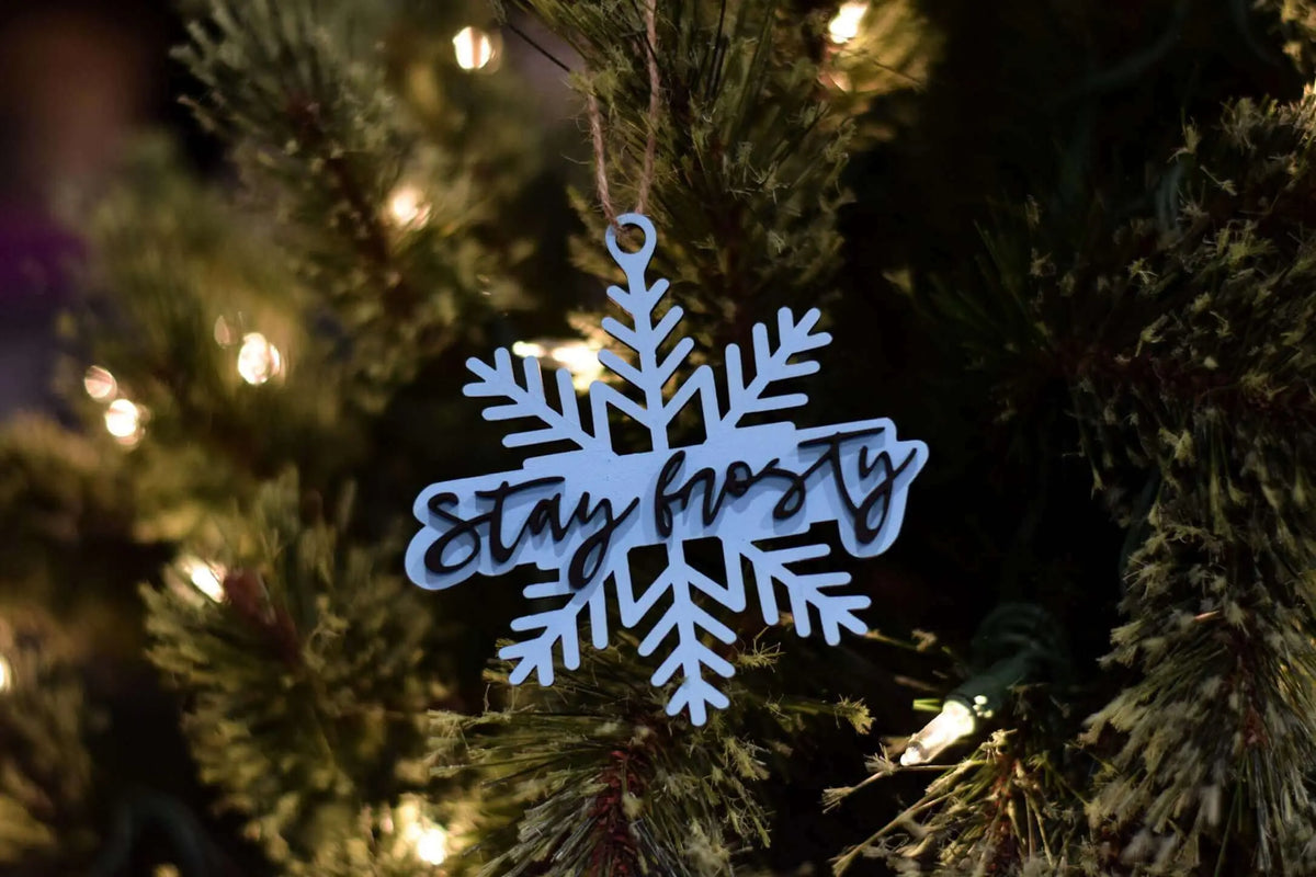 Stay Frosty Christmas ornament by Winks Design Studio, LLC, featuring a festive design perfect for holiday decor.