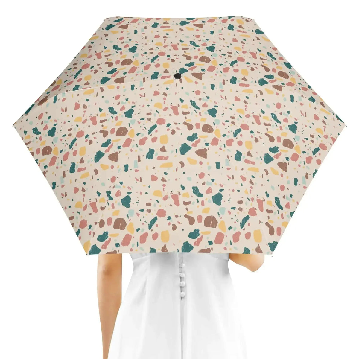 Winks Design Studio terrazzo rain umbrella with colorful speckled pattern and sturdy handle, perfect for rainy days.
