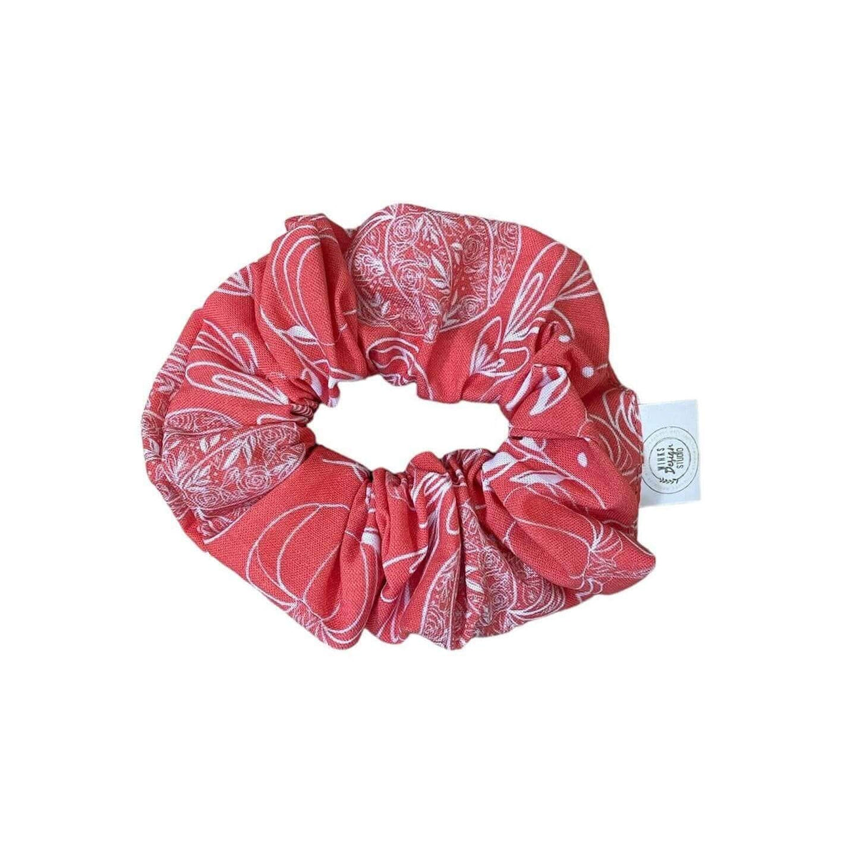 Flower Pumpkin Scrunchie from Winks Design Studio, LLC, featuring a colorful floral and pumpkin pattern on a soft fabric scrunchie.