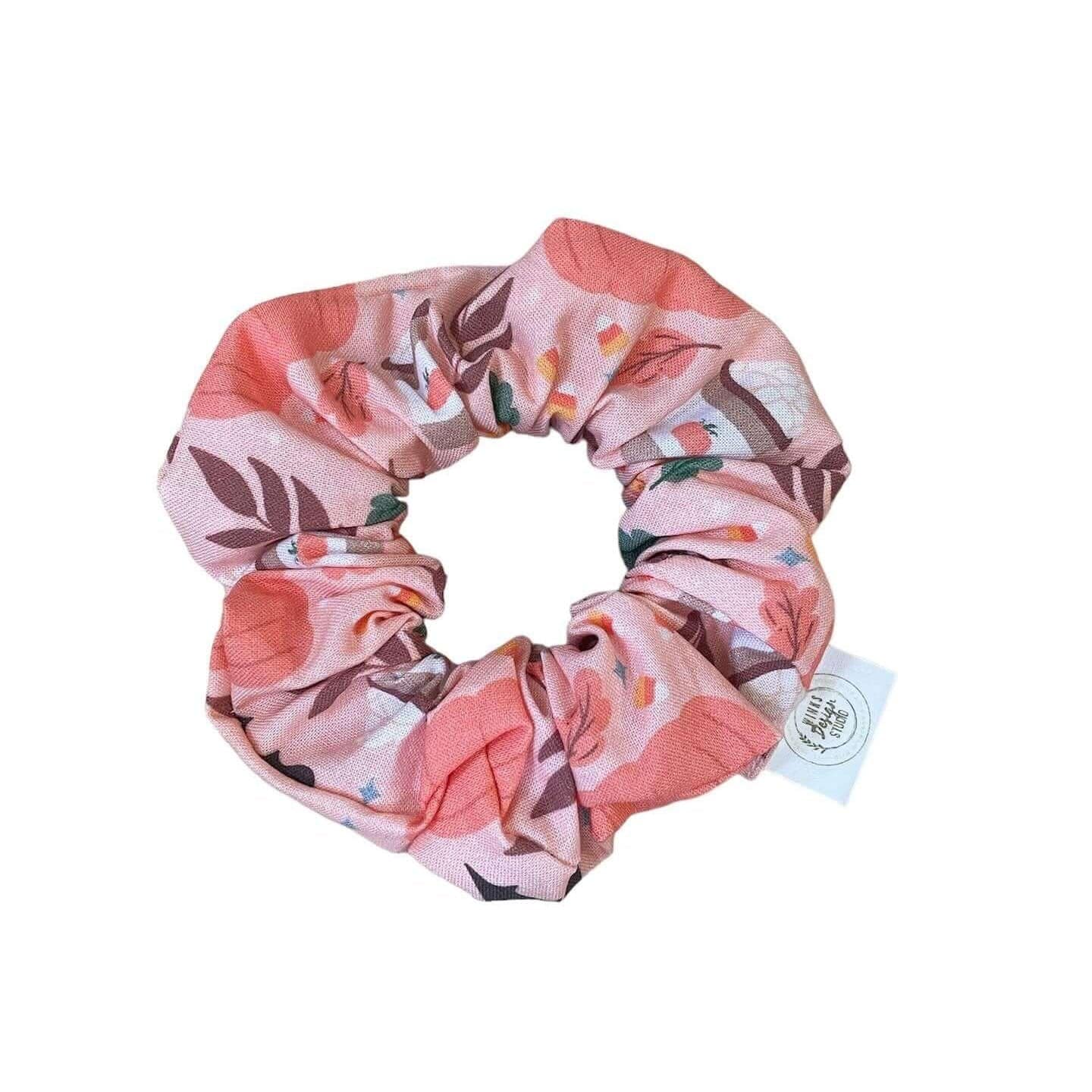 Fall-themed pumpkin patch scrunchie by Winks Design Studio, LLC, featuring cozy autumn-inspired fabric and stylish hair accessory.