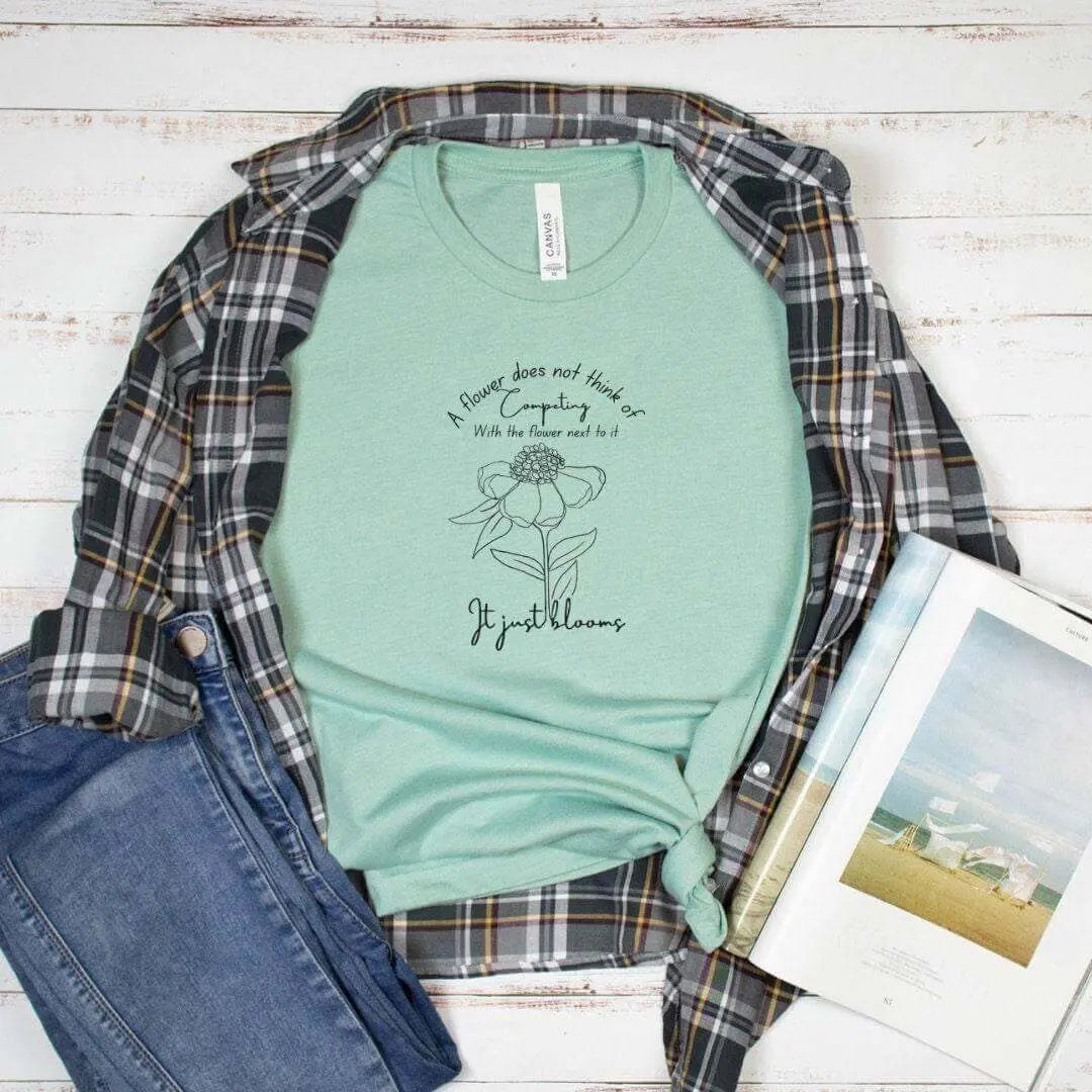 Mint green It Just Blooms Nature Quote T-Shirt by Winks Design Studio, LLC, featuring a botanical-inspired design and casual fit.