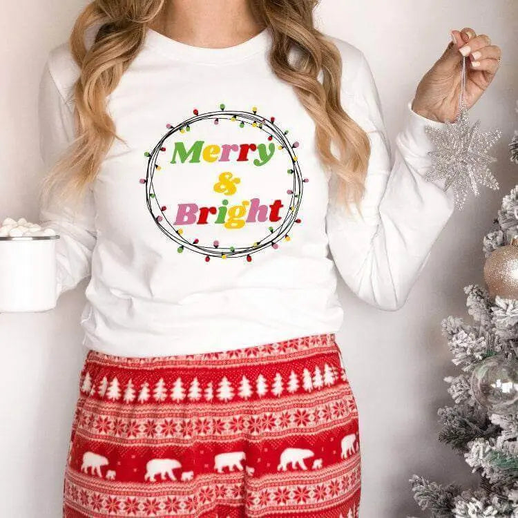 Small Merry and Bright shirt from Winks Design Studio, LLC, short-sleeve top with festive holiday design.