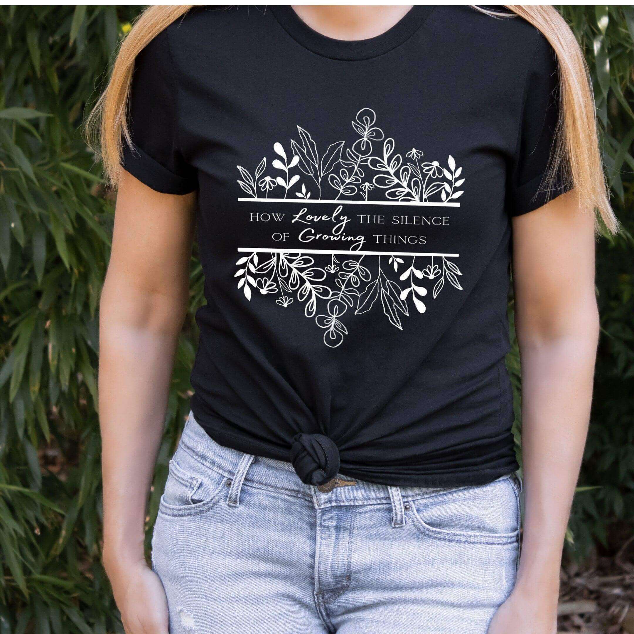 Black How Lovely the Silence of Growing Things T-shirt by Winks Design Studio, LLC, featuring a simple, stylish design.