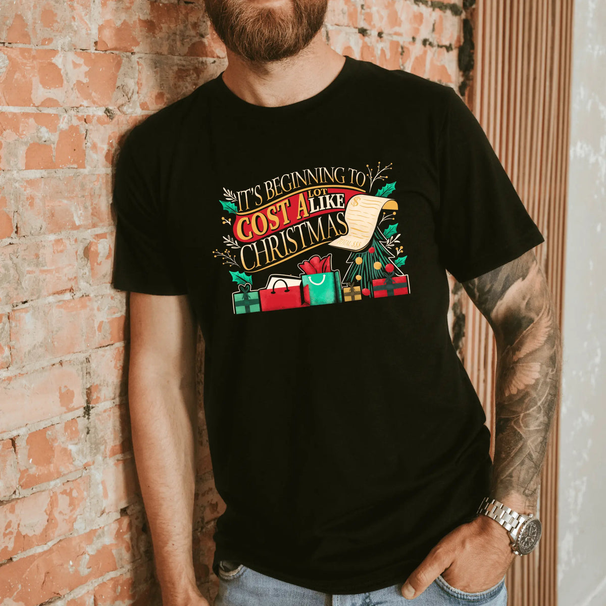 Winks Design Studio LLC Christmas-themed T-shirt with festive text, casual fit, perfect for holiday celebrations and winter wear.