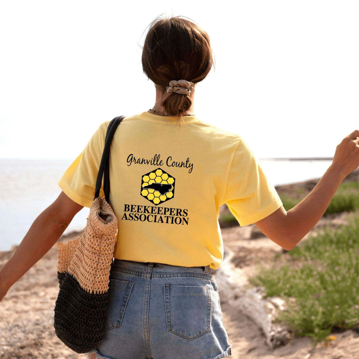 White GCBA Full Back Image T-Shirt by Winks Design Studio, LLC, featuring a detailed graphic on the back.