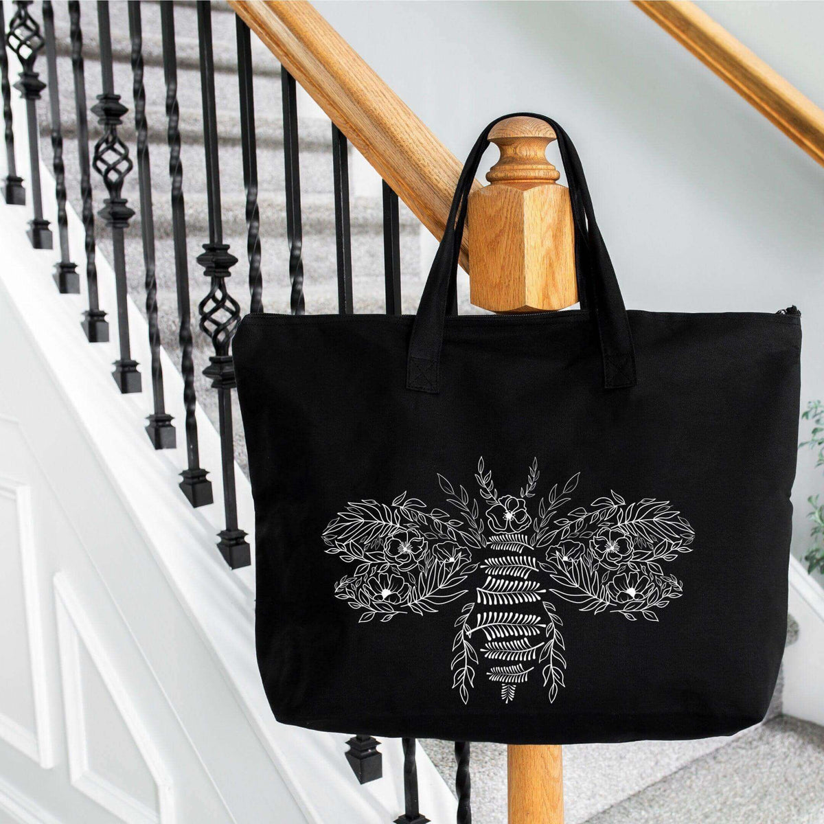 Flower Bee Tote Bag by Winks Design Studio, LLC, featuring a colorful floral and bee design on a sturdy shopping tote.