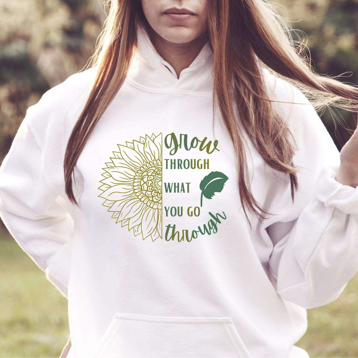 Winks Design Studio LLC sweatshirt with "Grow Through What You Go Through" slogan, soft fabric, and comfortable fit.