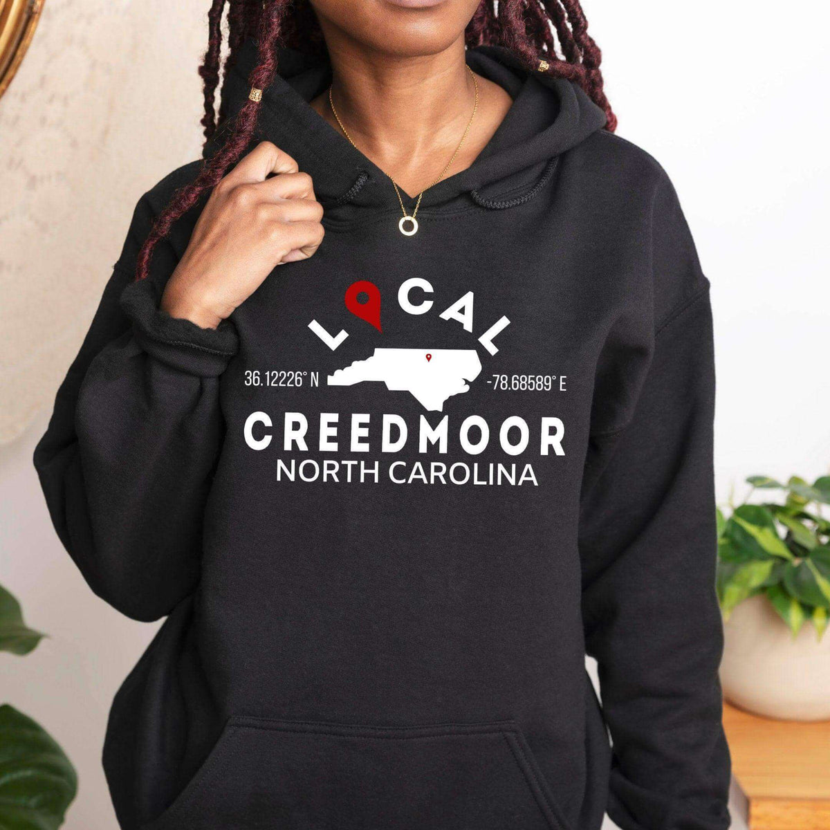 Tan custom city and state sweatshirt hoodie by Winks Design Studio, LLC featuring a small, printed geographic design.