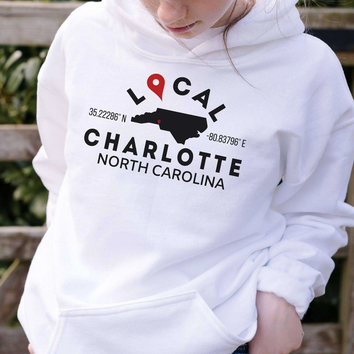 Tan custom city and state sweatshirt hoodie by Winks Design Studio, LLC with a small printed design on the front.