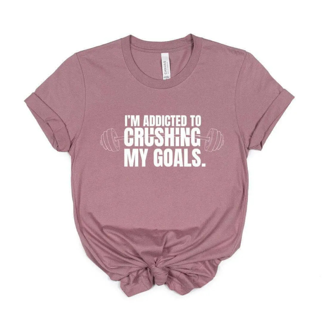 Black Crushing My Goals T-Shirt by Winks Design Studio, LLC, shown in small size with bold text on front.