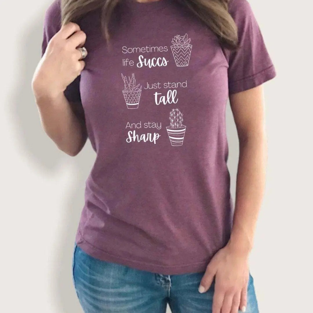 Black Life Succs Funny Plant T-shirt from Winks Design Studio featuring a humorous plant design on the front.