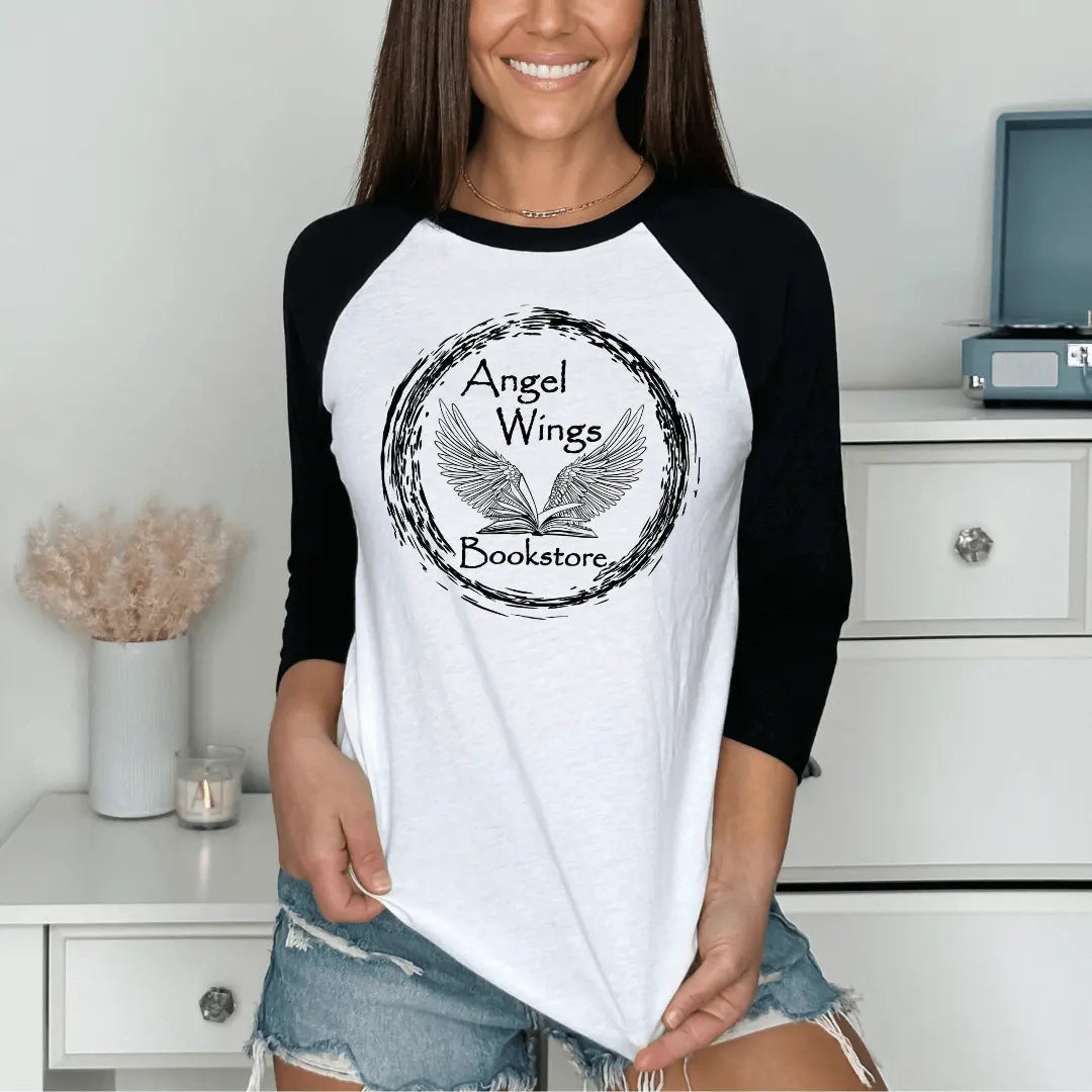 Black and white raglan baseball T-shirt with angel wings and bookstore graphic by Winks Design Studio, LLC.