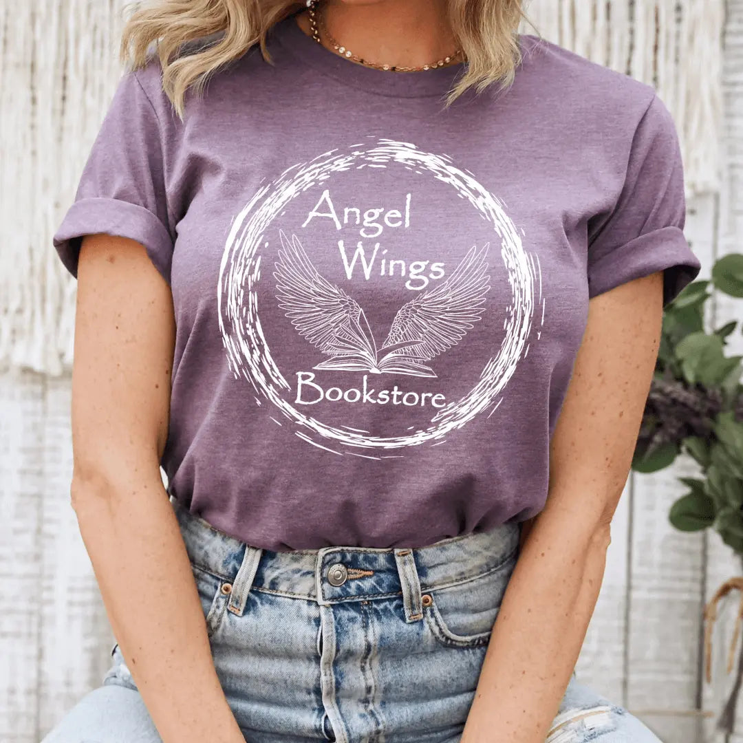 Gray short sleeve T-shirt by Winks Design Studio featuring angel wings and bookstore circular graphic design.