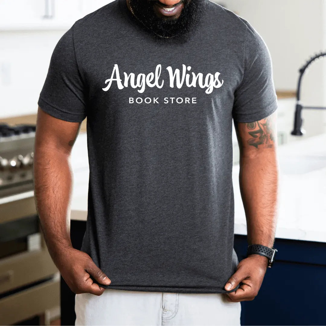 Heather purple T-shirt with horizontal angel wings and bookstore graphic by Winks Design Studio, LLC.