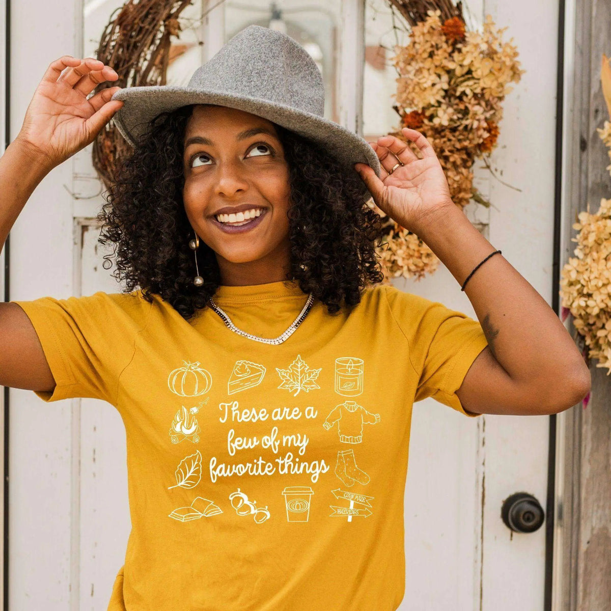 Mustard yellow Fall Favorite Things T-shirt by Winks Design Studio, LLC, featuring autumn-themed design on a casual T-shirt.