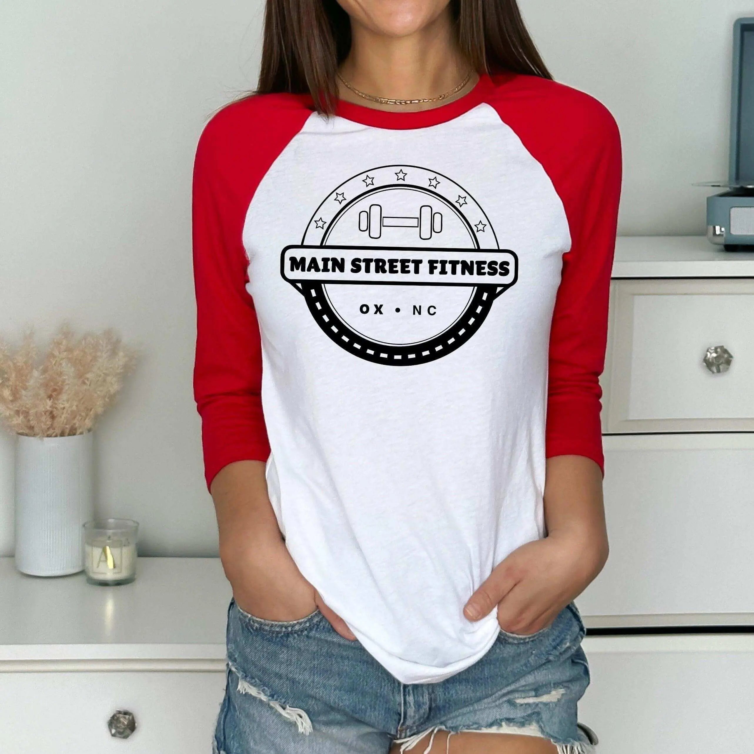 Red and white raglan baseball T-shirt by Winks Design Studio LLC featuring "Main Street Fitness" design.