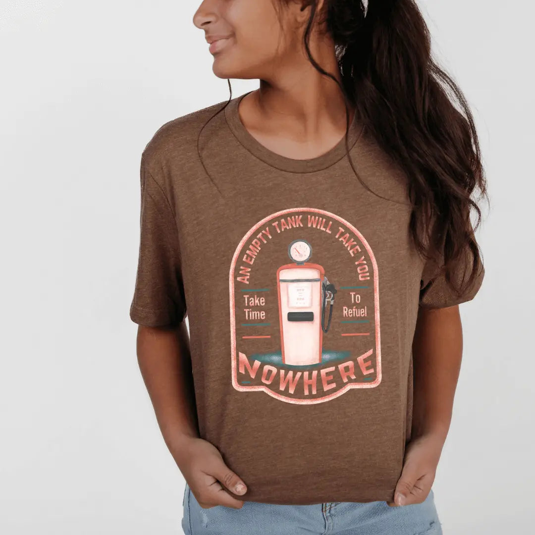 Winks Design Studio LLC T-shirt featuring the phrase "An Empty Tank Will Take You Nowhere" printed on a casual cotton tee.