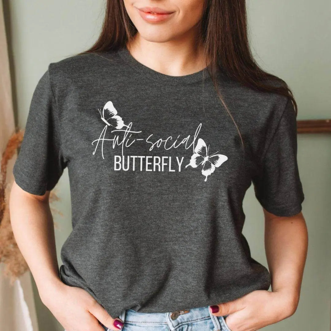 Winks Design Studio LLC anti-social butterfly T-shirt featuring a colorful butterfly graphic on a casual T-shirt.