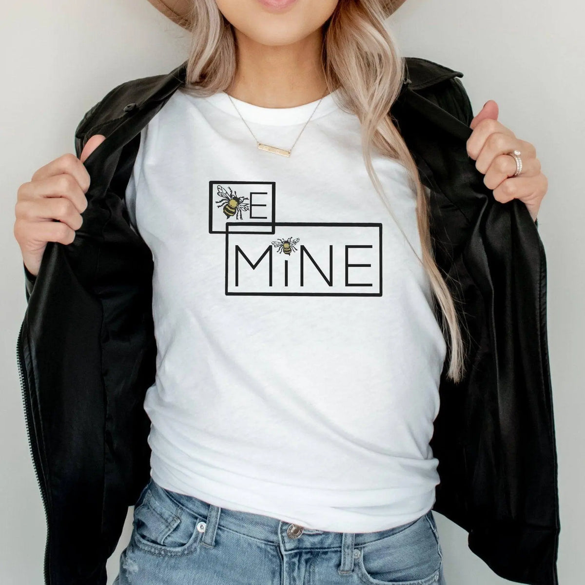 Winks Design Studio LLC Be Mine Bumblebee T-shirt featuring a cute bumblebee graphic on a soft fabric tee.