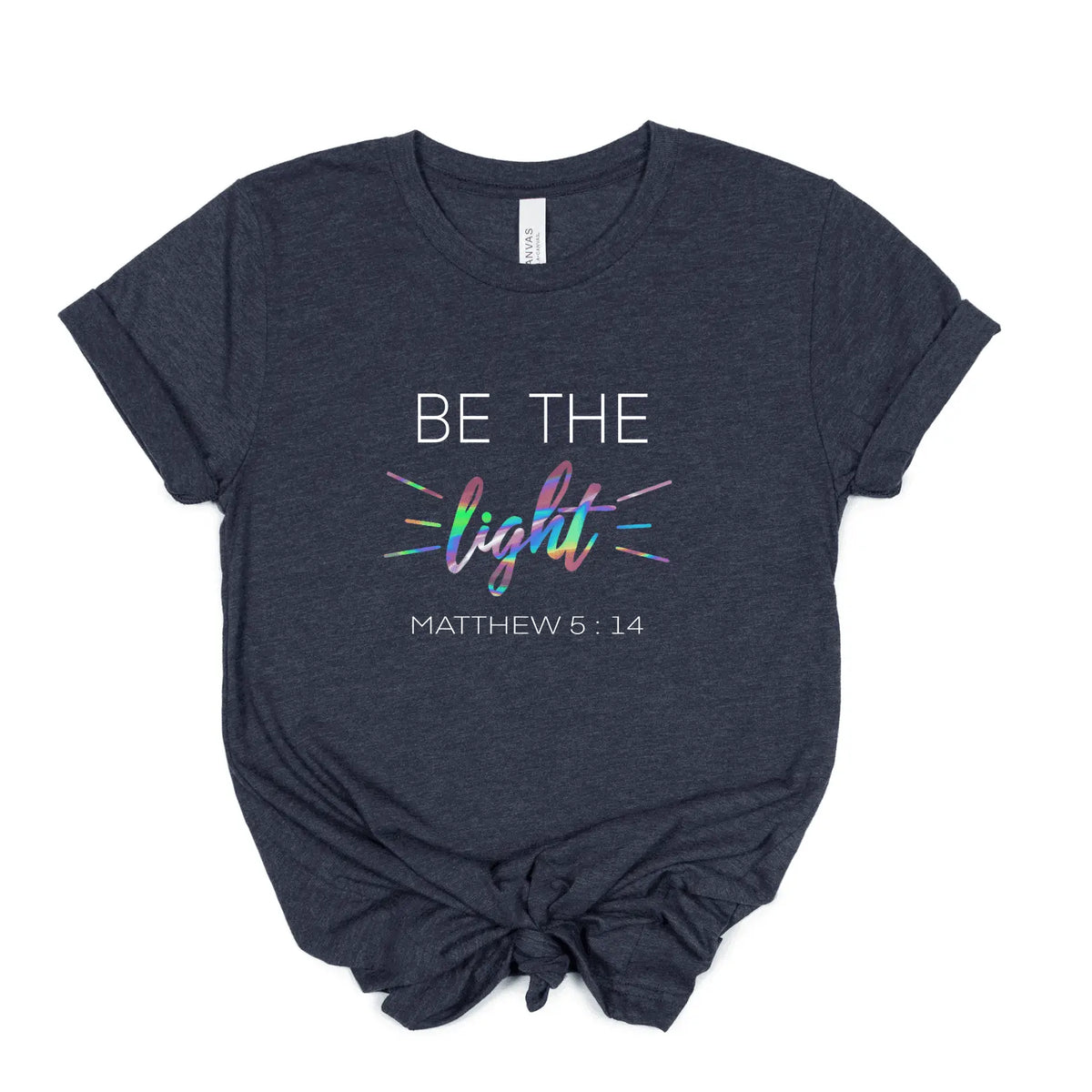 Be The Light T-shirt by Winks Design Studio, LLC, featuring a casual fit with a motivational design, shown in a small size.