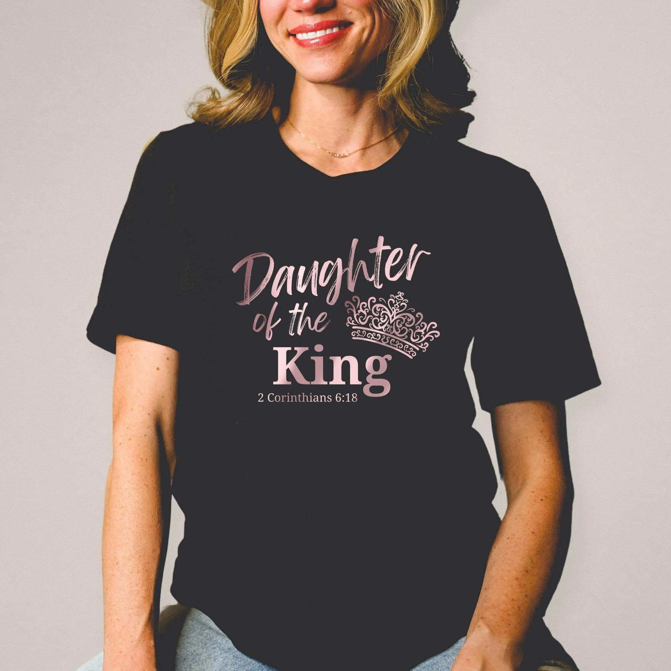 Winks Design Studio LLC Daughter of the King T-shirt featuring a soft fabric and biblical-inspired design on a light-colored background.